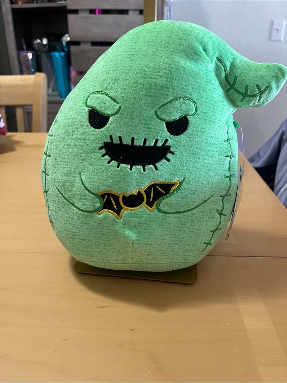 Squishmallows Oogie Boogie Green Plush with Black & Gold Bat Accent